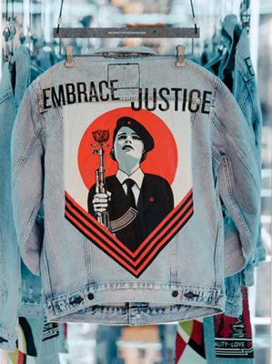 denim jacket with design saying "embrace justice"