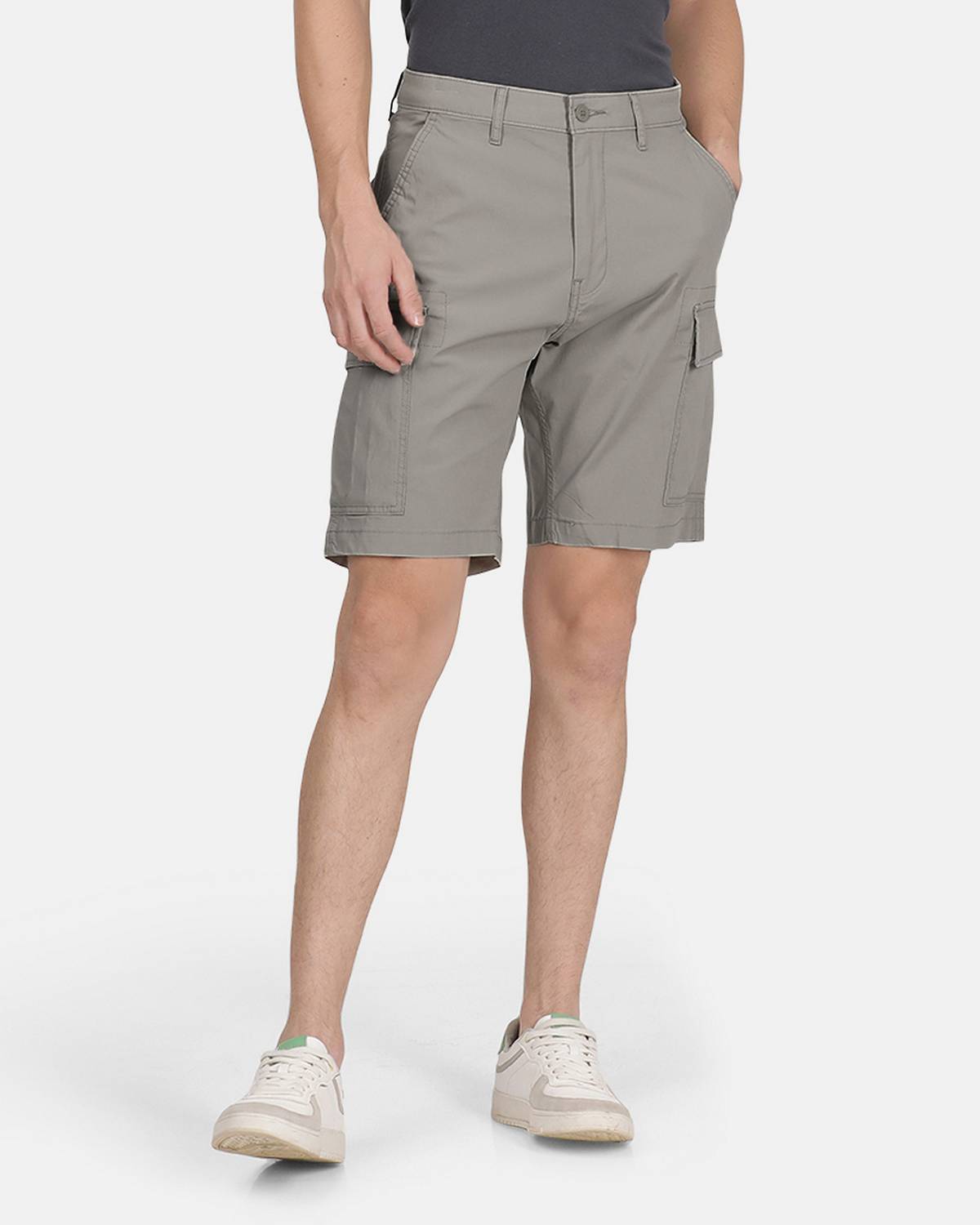 Model wearing tan cargo shorts