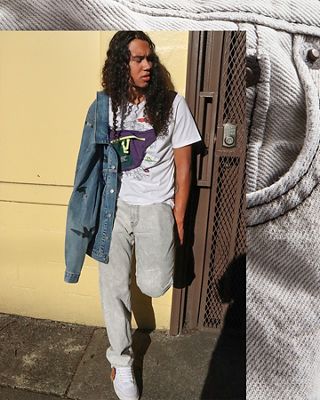 Skip Jones standing against a wall with a Levi's Trucker Jacket and wearing Levi's jeans