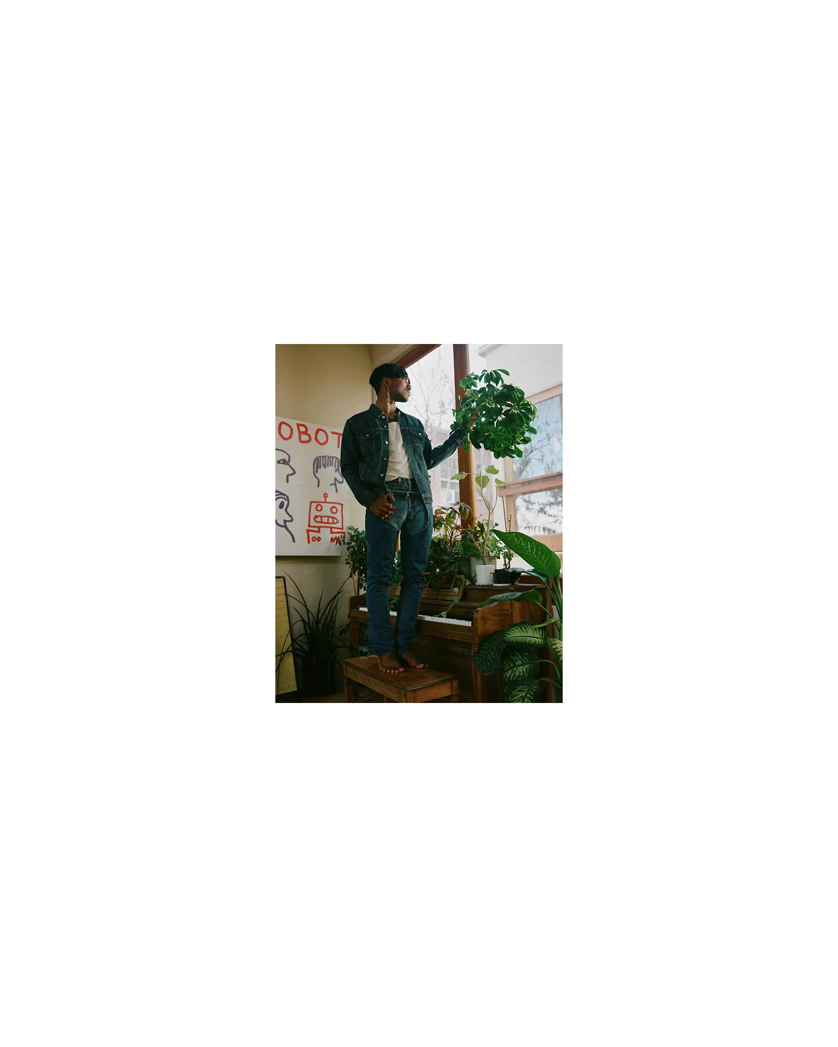 GIFs of Jerrod La Rue in his plant-filled home.