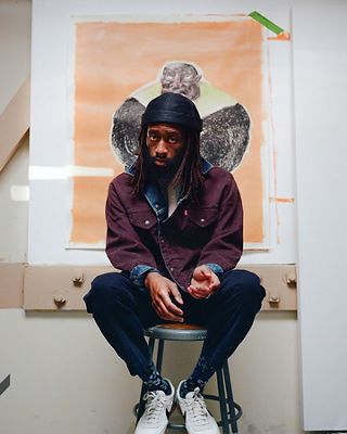 Portrait of Joonbug sitting in his studio.