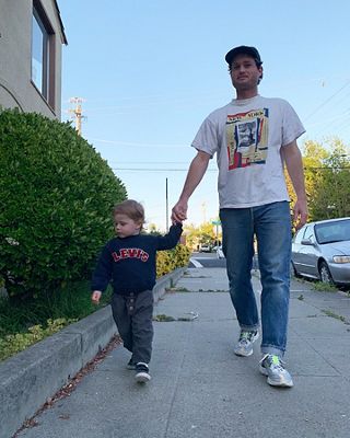 Photo of Josh with his son.