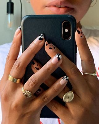 Close-up selfie of Evelynn Escobar-Thomas' nail art.