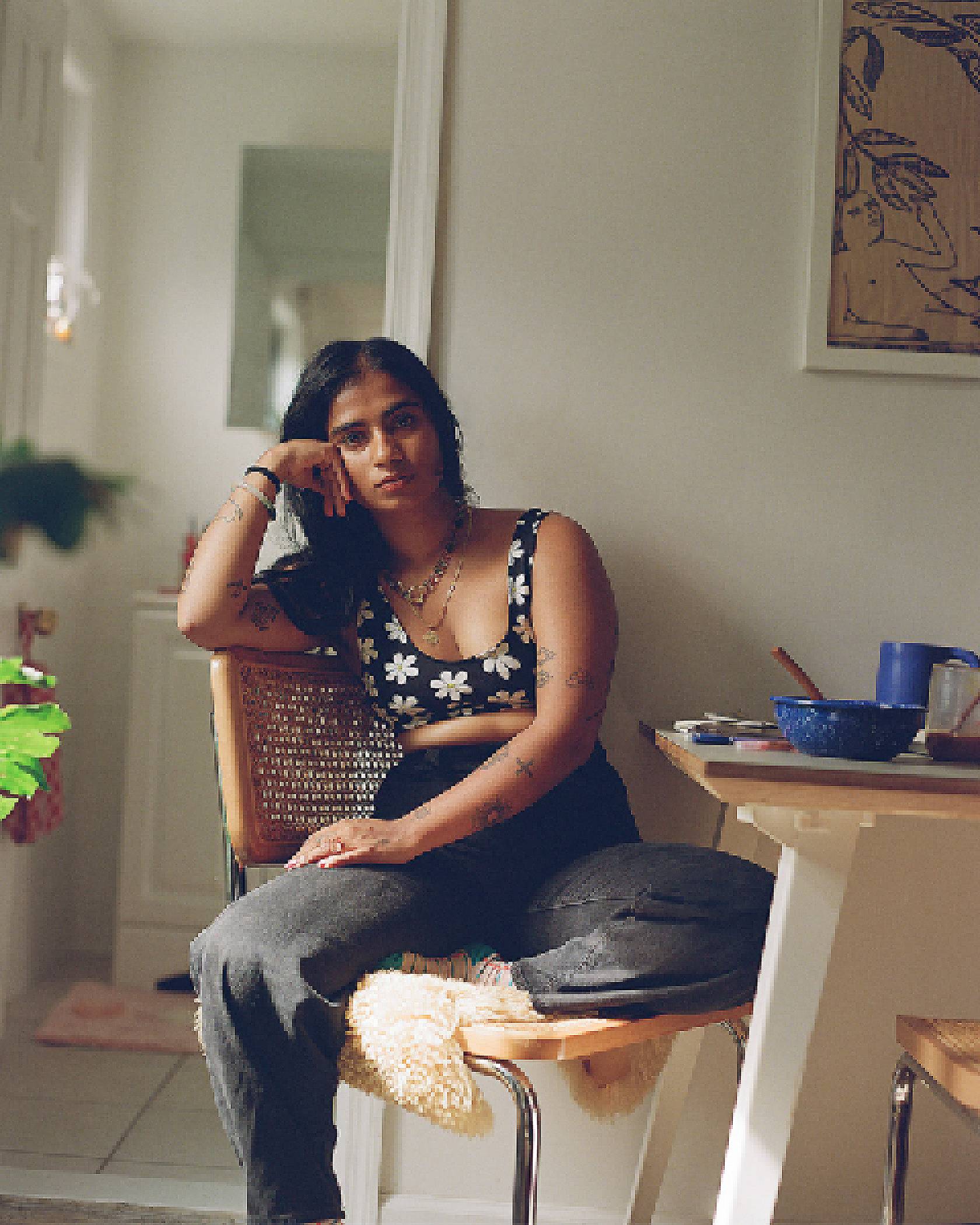 Portrait of Fariha Róisín sitting in her home.