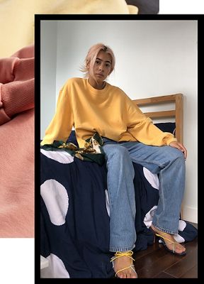 Michelle Li sitting in her hanging out at the park outfit