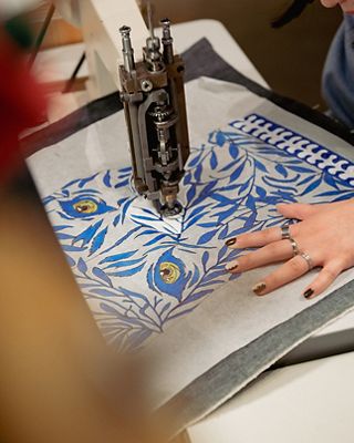 Custom embroidery being done by sewing machine.