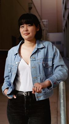 Lisa Hon standing wearing Levi's jacket