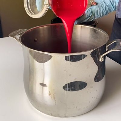 red acrylic pain poured in pot