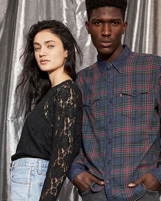 man and woman in holiday new year's eve outfits