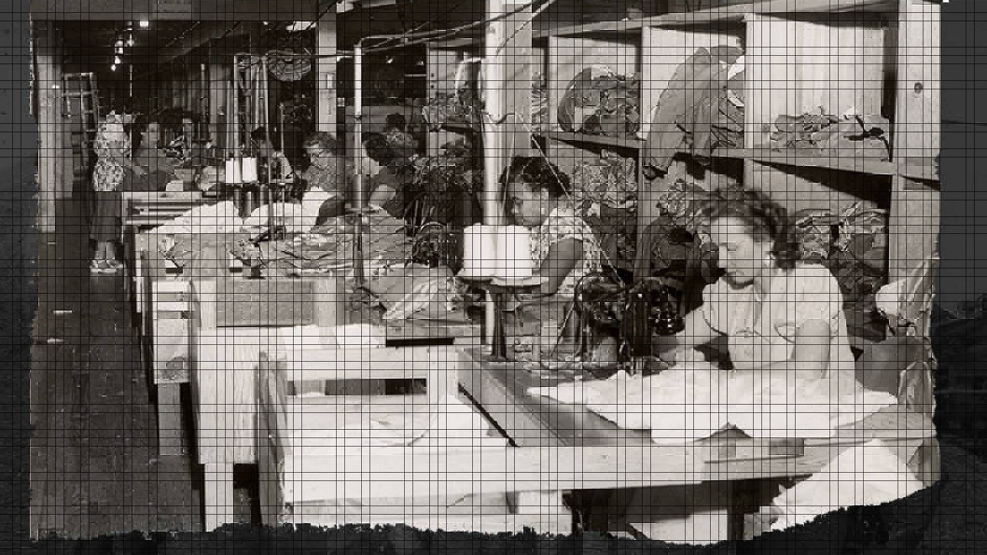Vintage photo of employees working with sewing machines, making Levi's® denim jeans.