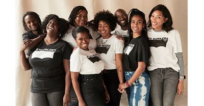 Black Levi's® employees posing in customized t-shirts for Black History Month.