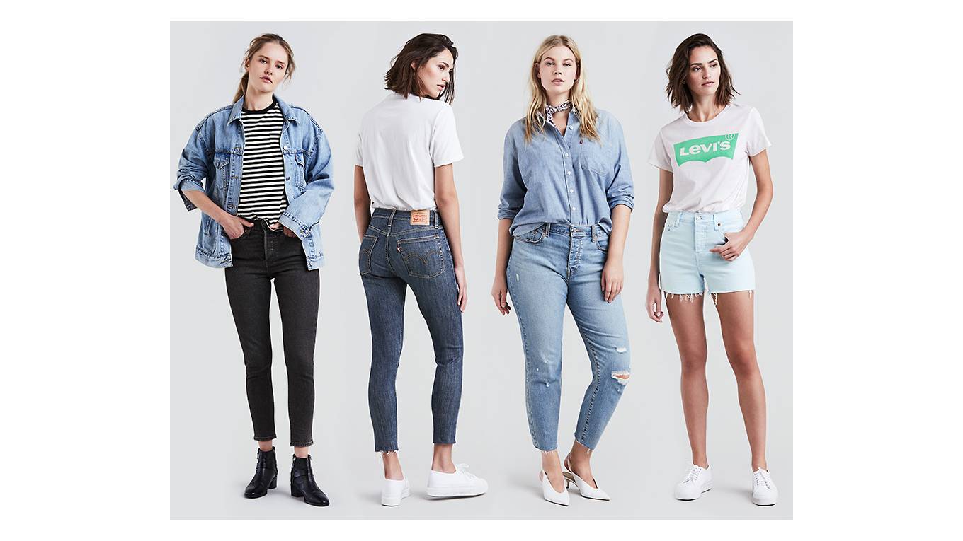 Four woman standing in front of a white background wearing four different levi's styles.