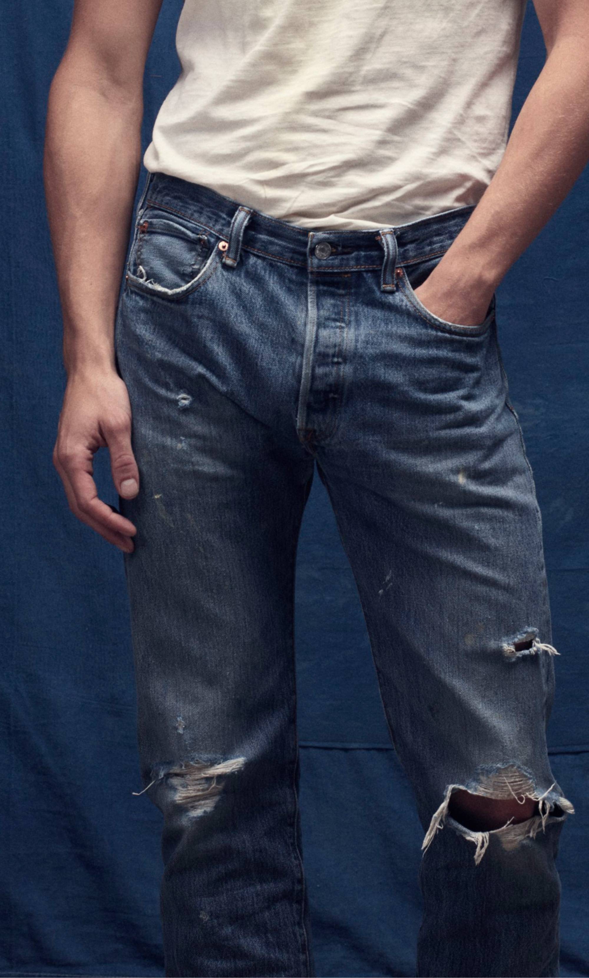 Man in jeans with hand in pocket