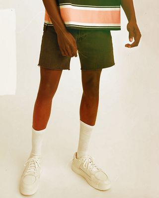 Man wearing denim Shorts