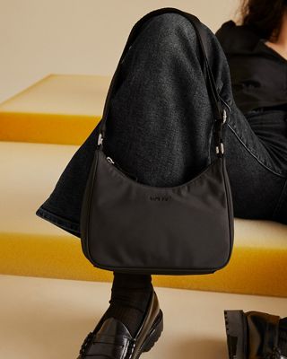 Woman wearing pink bucket hat with white shirt