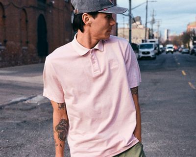 We love polos for many reasons. Chief among them: their unmatched versatility. You can dress them up or down, wear them under or with anything, and they'll always look on-point.