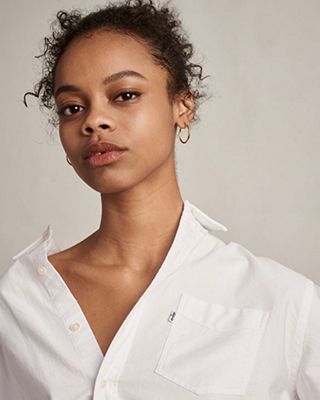 man and woman wearing white colored denim