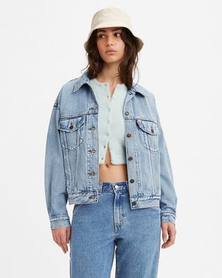 Female model wearing a jean jacket and jean pants.