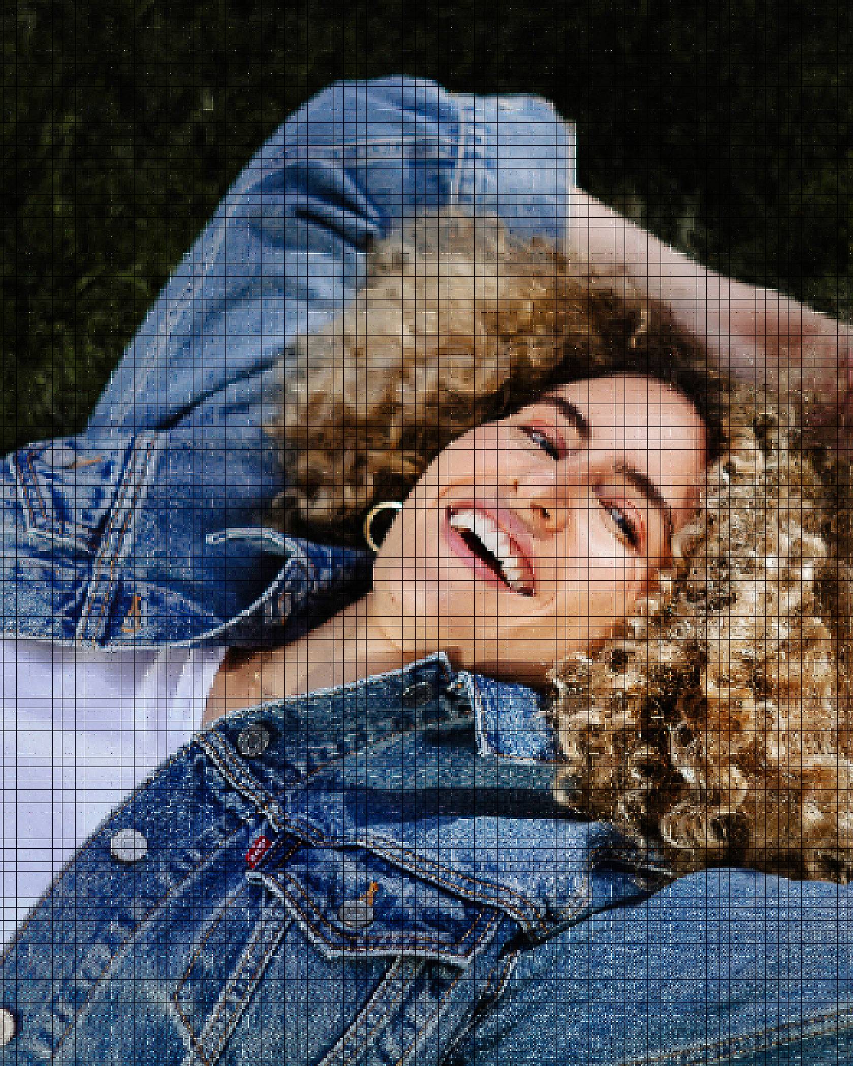 woman laying down with denim jacket