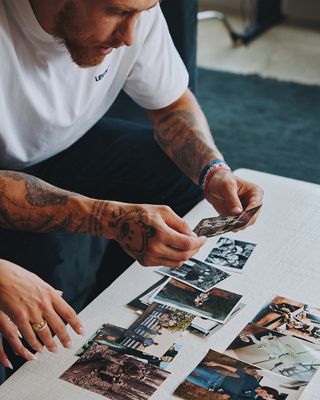 Image of George Kittle looking at photos.