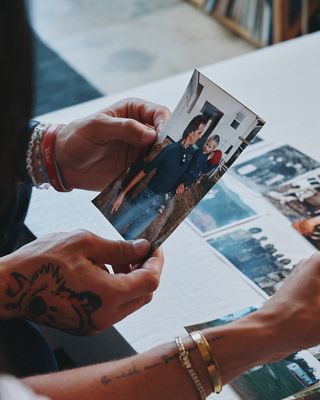 Image of George Kittle holding photos.