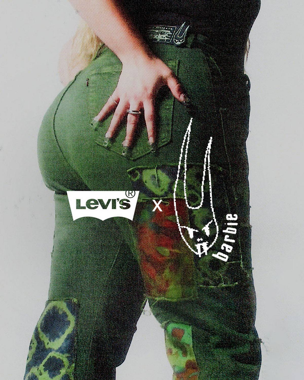 Model wearing a green, patchwork Levi's® x Barbie Ferreira jeans.