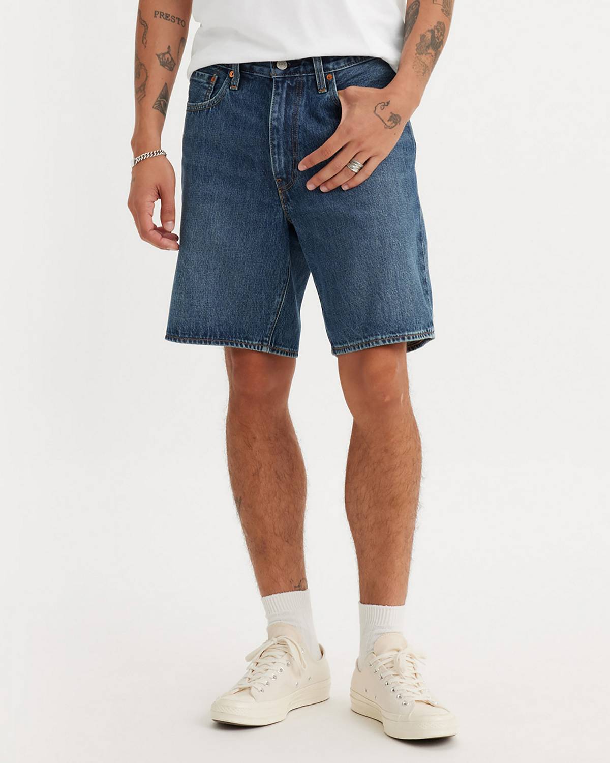 Model wearing denim loose fit shorts