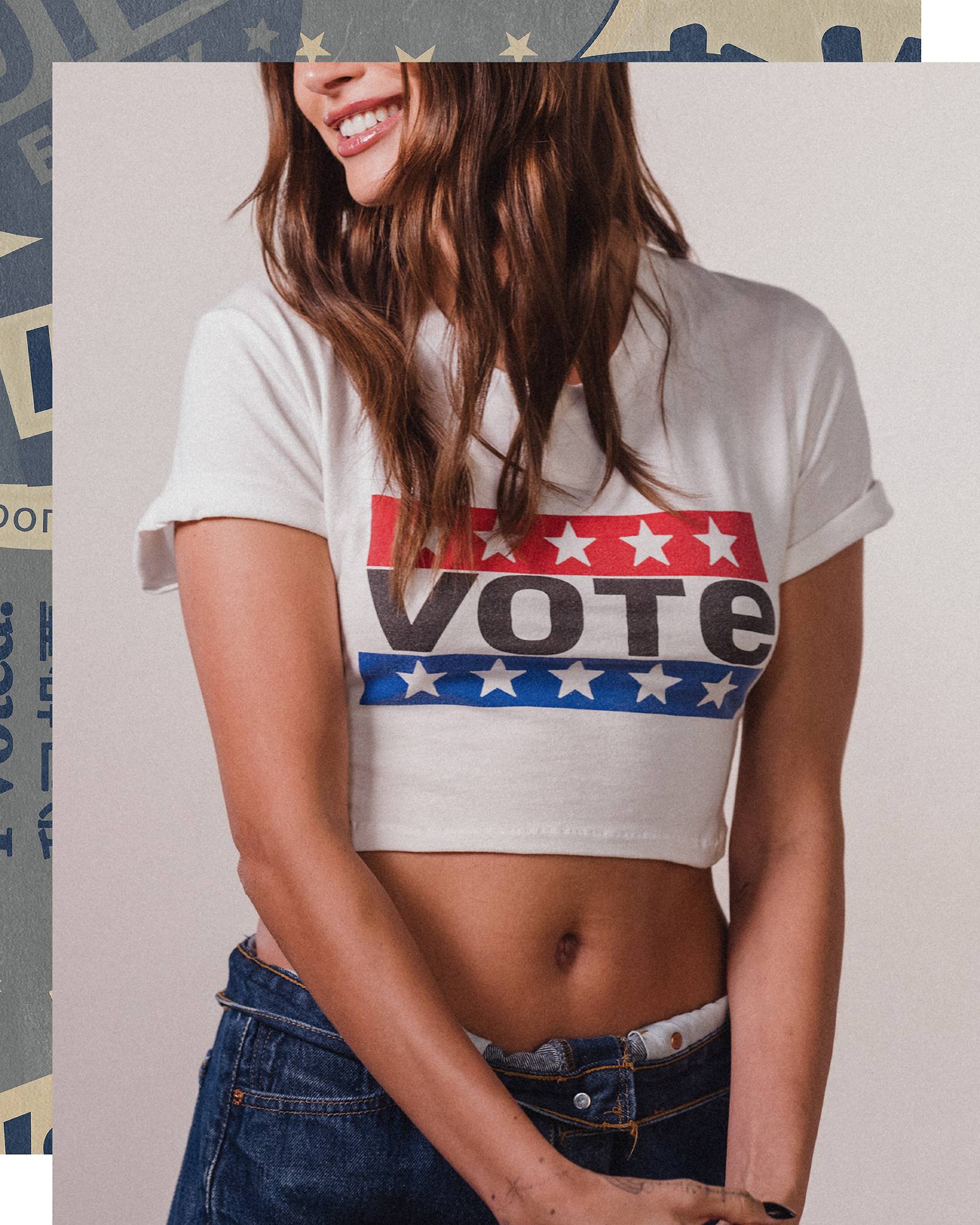 Three people sitting down in the open trunk of a truck, wearing Levi's Vote product.