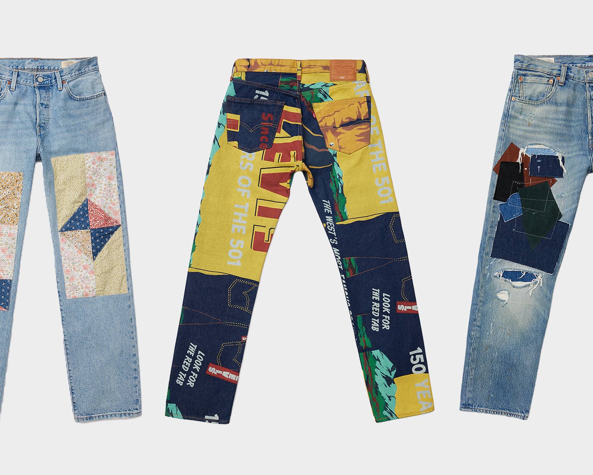 Three customized 501 jeans on a white background.
