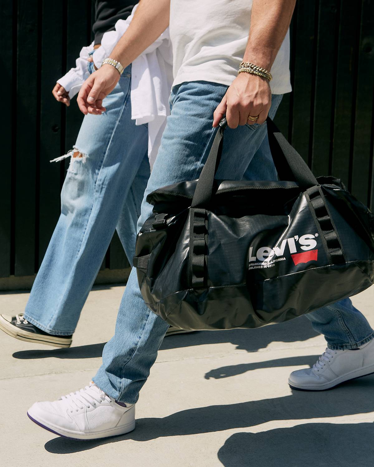 Person carrying a Levi's® duffle bag
