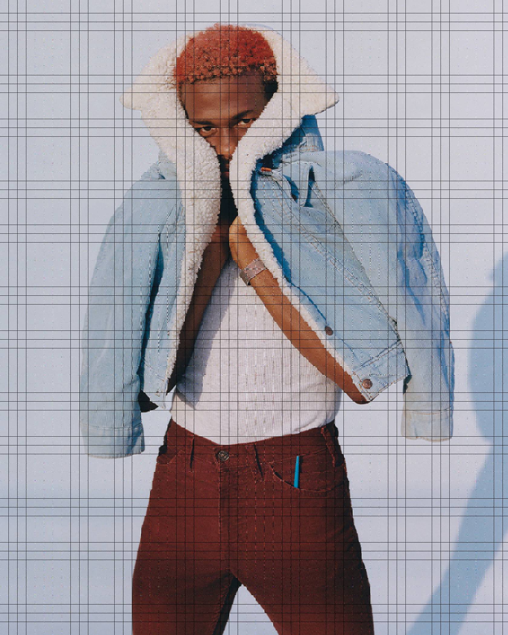 Photo of Duckwrth wearing a Levi's Sherpa Trucker Jacket and maroon corduroy Levi's jeans.