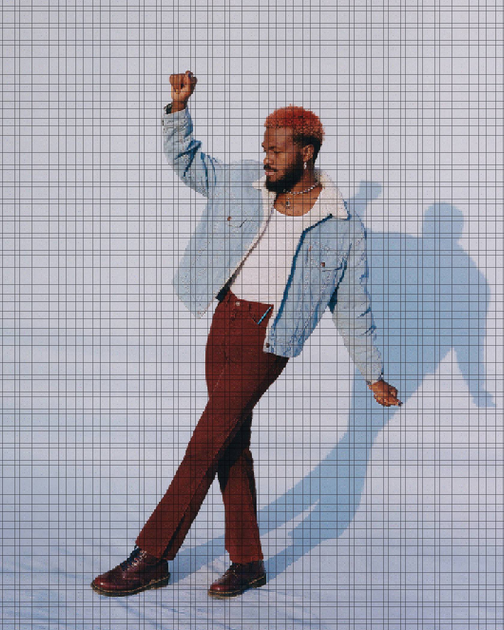 Photo of Duckwrth wearing a white tank top with a Levi's Sherpa Trucker Jacket and maroon Levi's corduroy jeans.