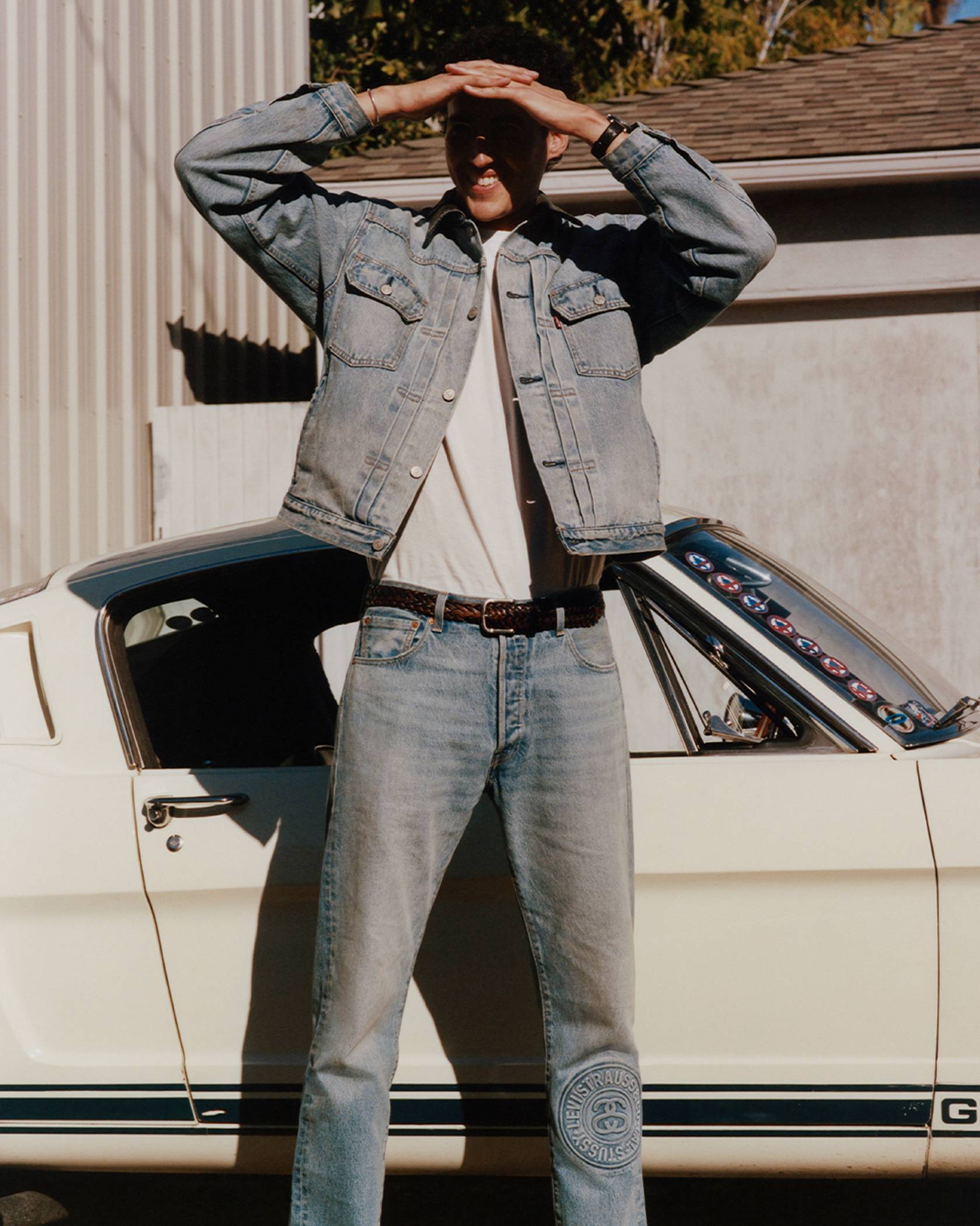 man wearing jean jacket and jeans