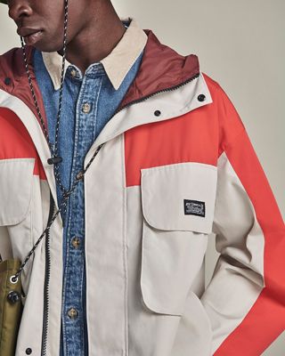 Close up of color blocked wind breaker, denim shirt with corduroy collar 2022_fall_outfits_for_men