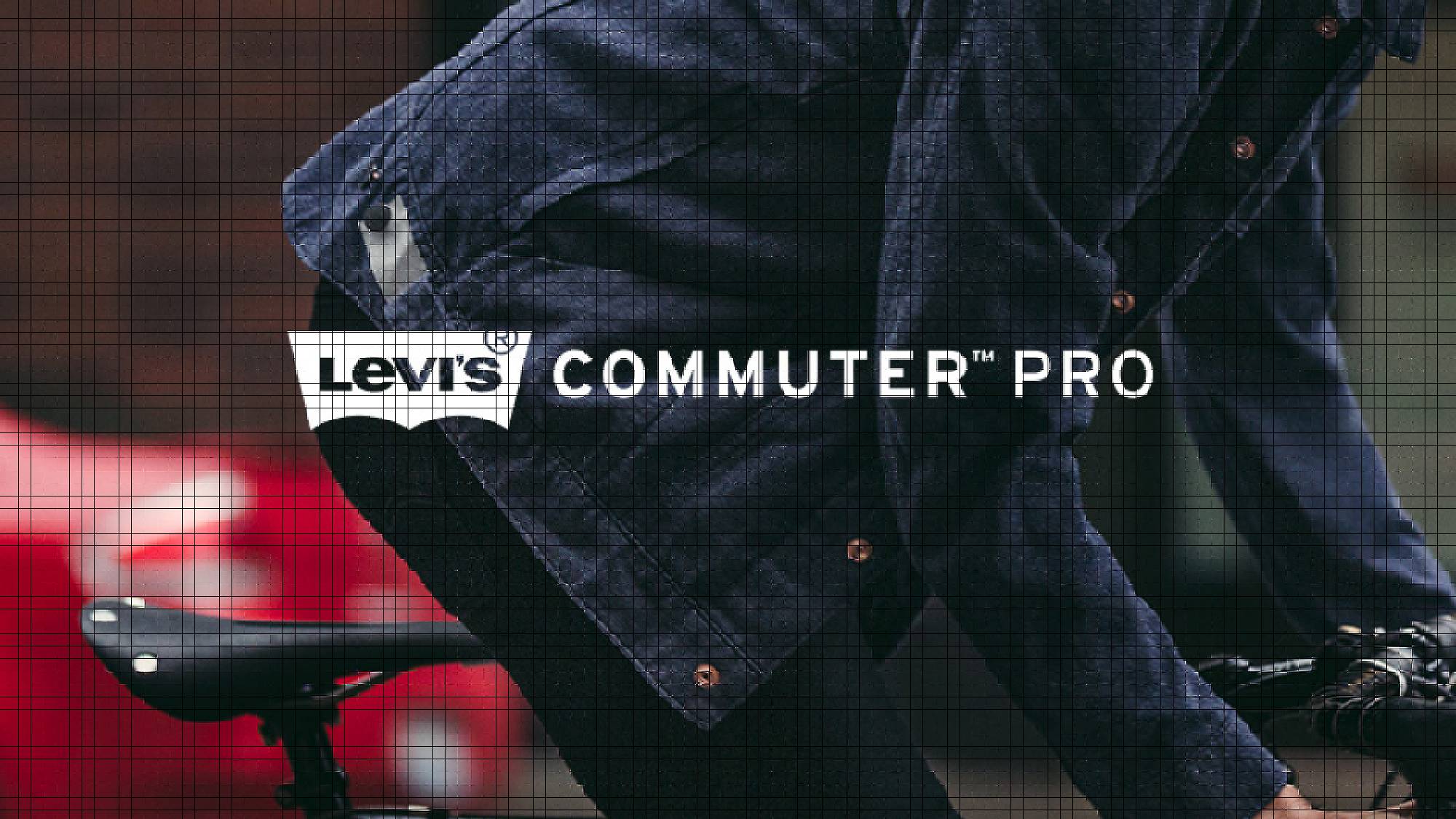 Levi's commuter pro. Man wearing a denim jacket riding a bike. Red car in background.