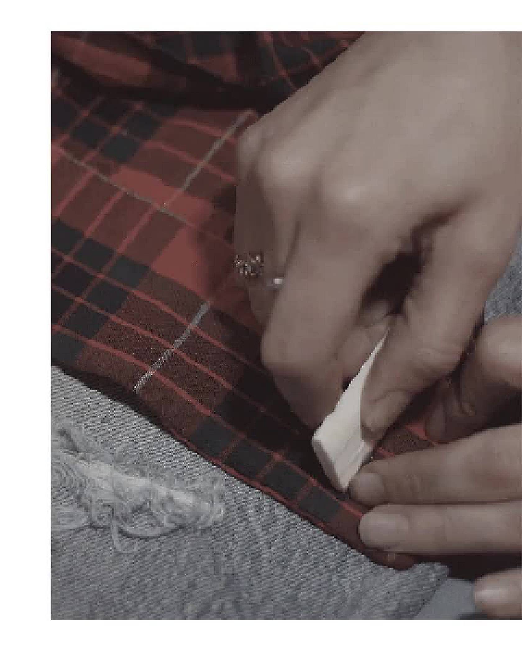 Video of a Levi's® Tailor customizing a pair of Levi's® 501® Original Jeans.