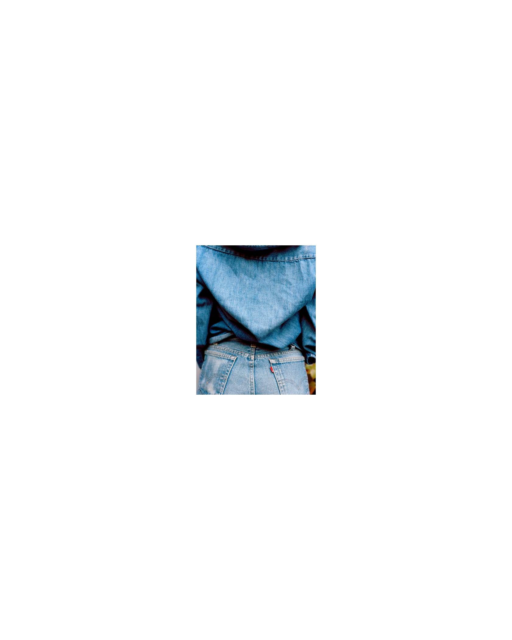 Image of a denim jacket and jeans.
