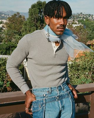 Portrait of Jerrod La Rue surrounded by plants.