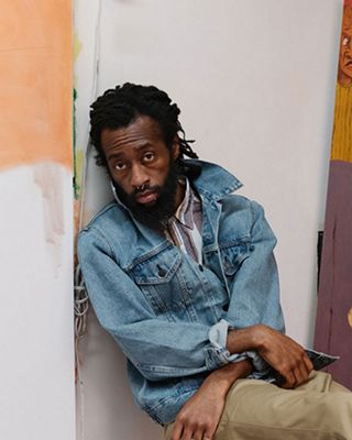 Portrait of Joonbug with his paintings.