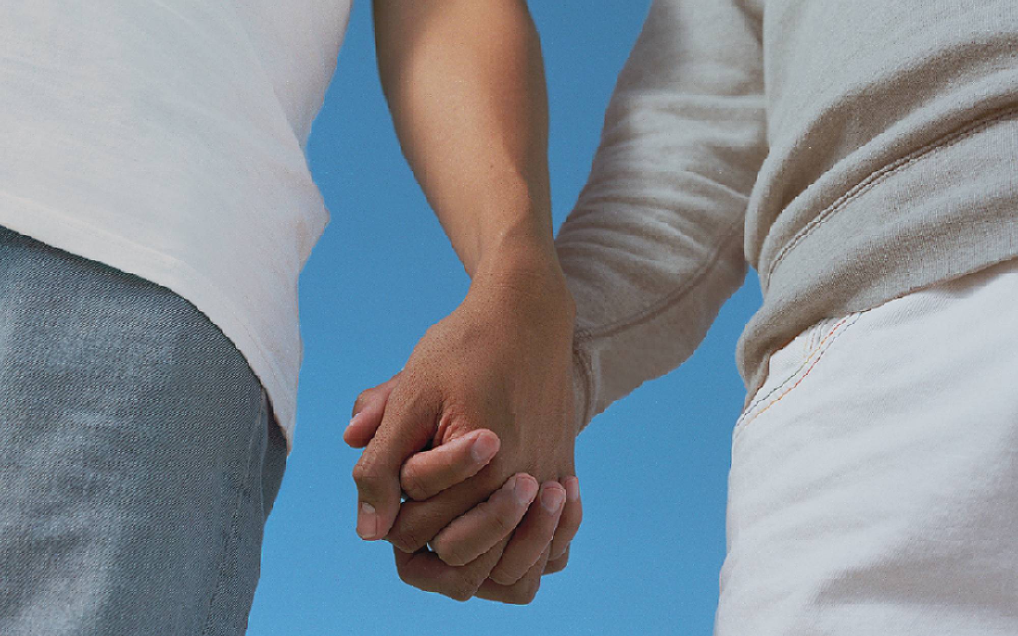 a photo of two people holding hands