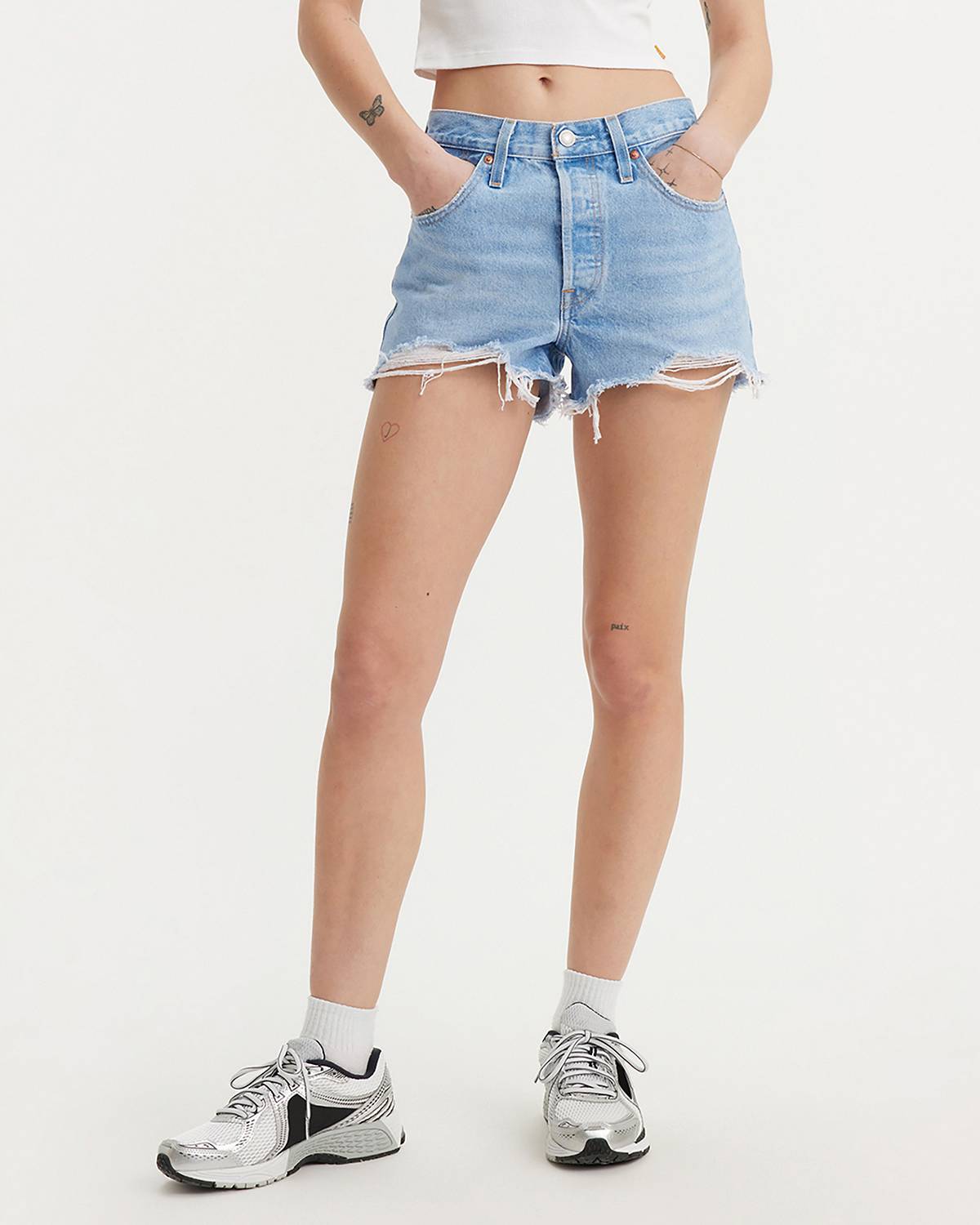 Female model wearing jean shorts.