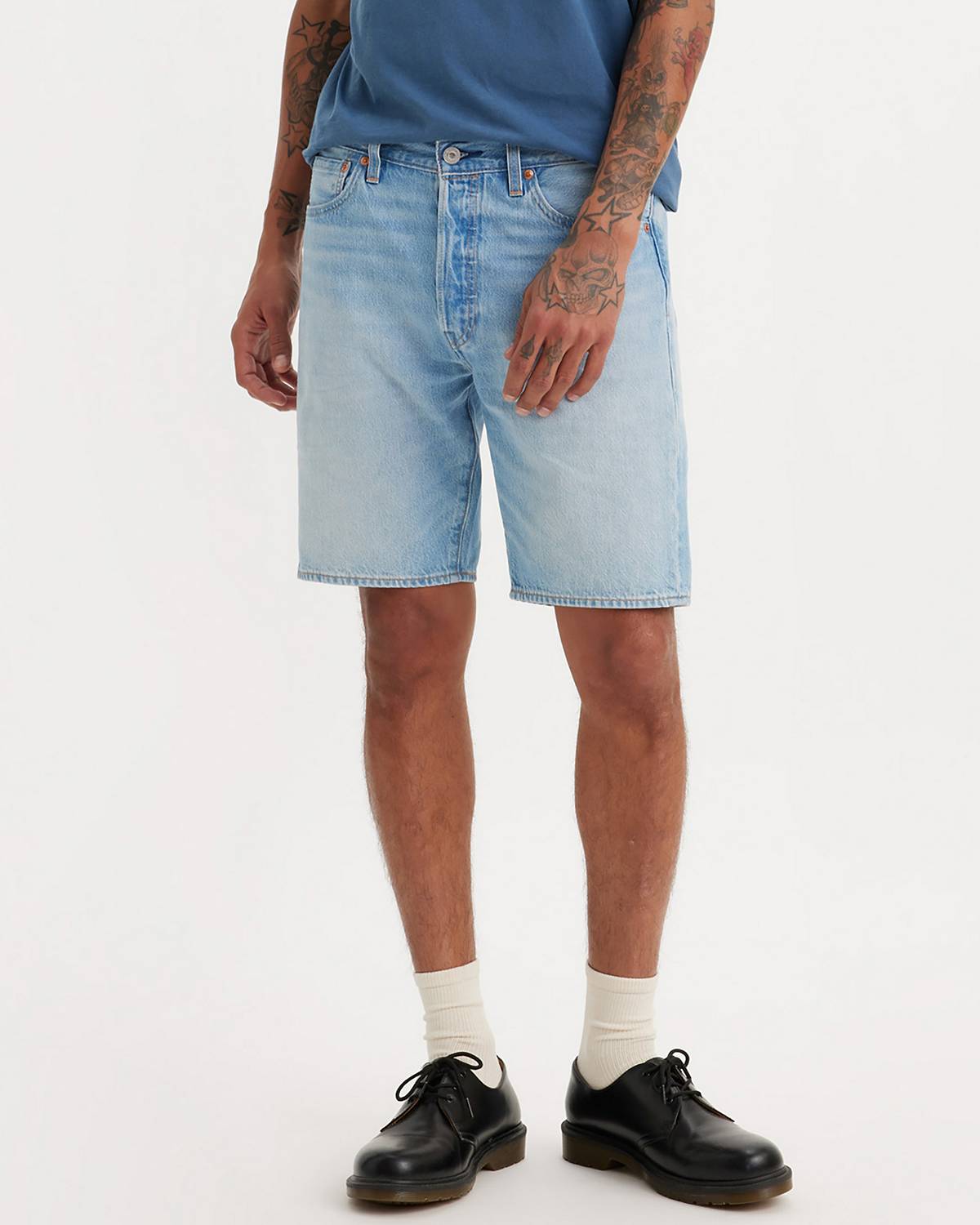 Male model wearing jean shorts.