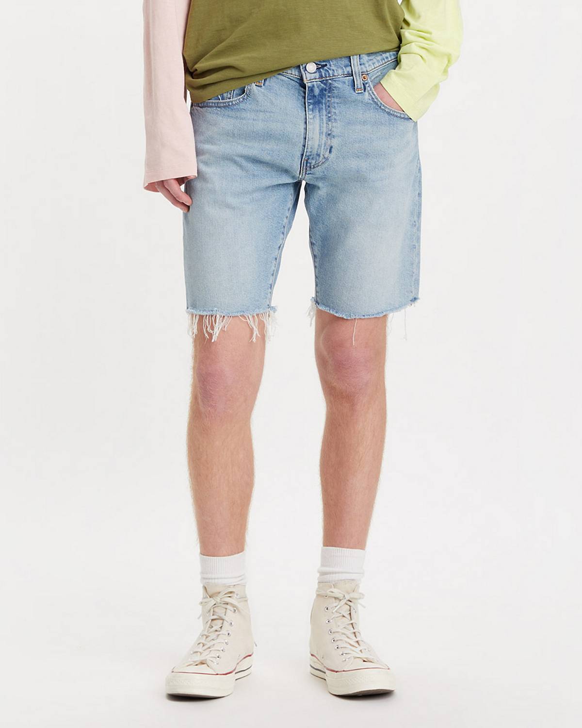 Model wearing denim slim fit shorts.