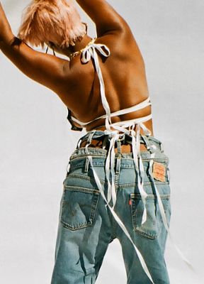 Photo of a woman with pink hair wearing denim head-to-toe.