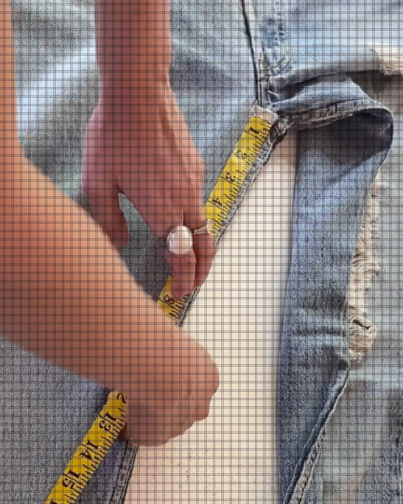 tape measure measuring inseam of blue jeans