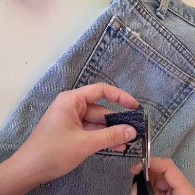 cutting fabric into a patch