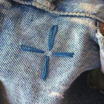 four petals shape of cross on denim embroidered