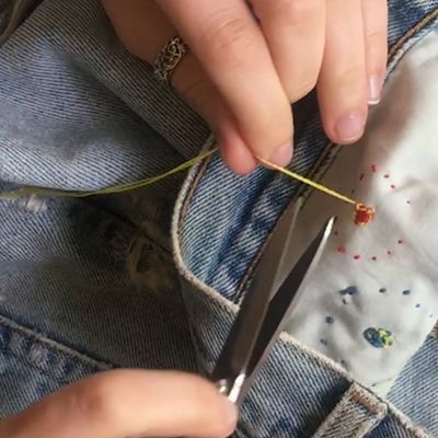 knot on backside of denim fabric