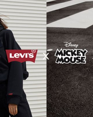 man and woman in denim outfits and mickey mouse