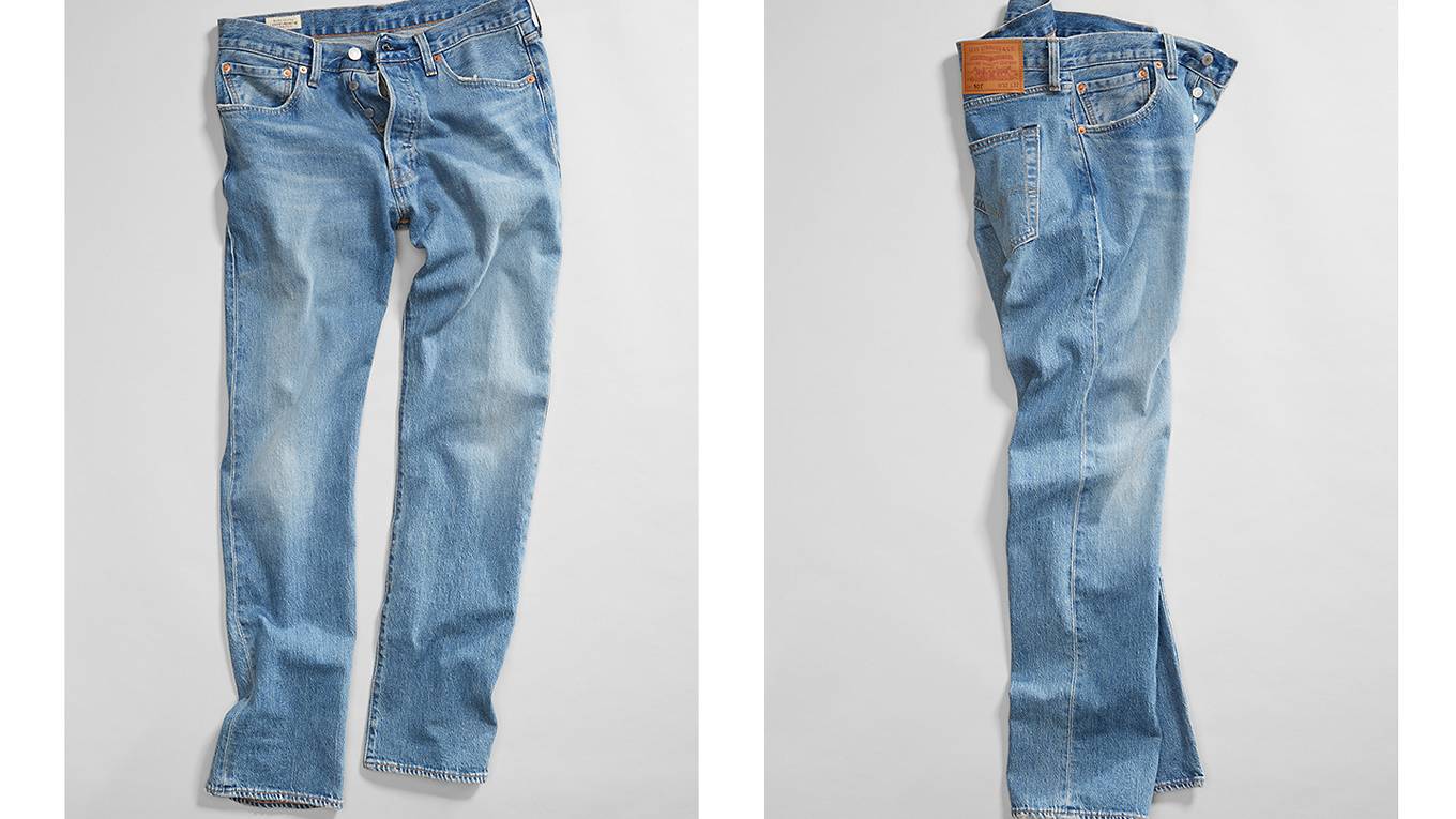 A pair of jeans spread out on the ground, two different angles of the jeans are shown.